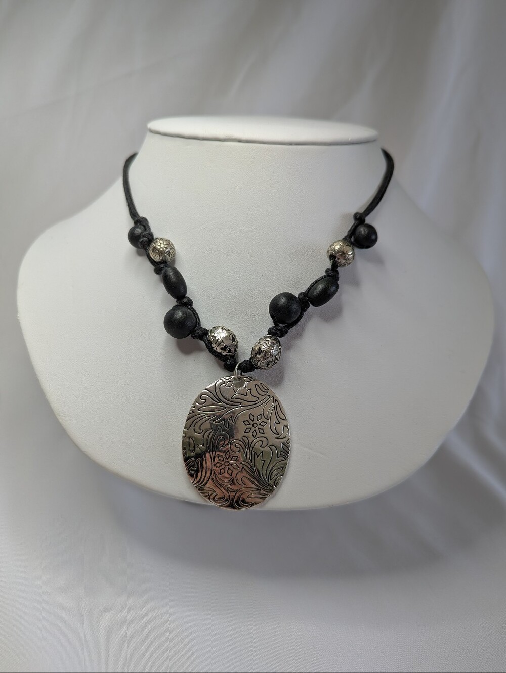 Handcrafted Black Bead Necklace with Silver Floral Pendant